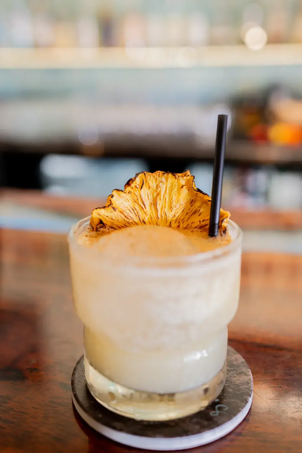 Creamy coconut cocktail crowned with a toasted pineapple crisp at Jackie Rey's Kona.