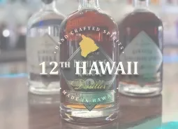 Bottles of 12th Hawaii Distiller small-batch spirits, a local spirits partner of Jackie Rey's Kona.