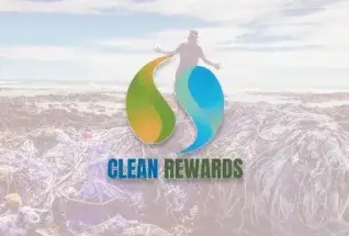 Clean Rewards logo over a Hawaii shoreline cleanup, a sustainability partner of Jackie Rey's in Kona.