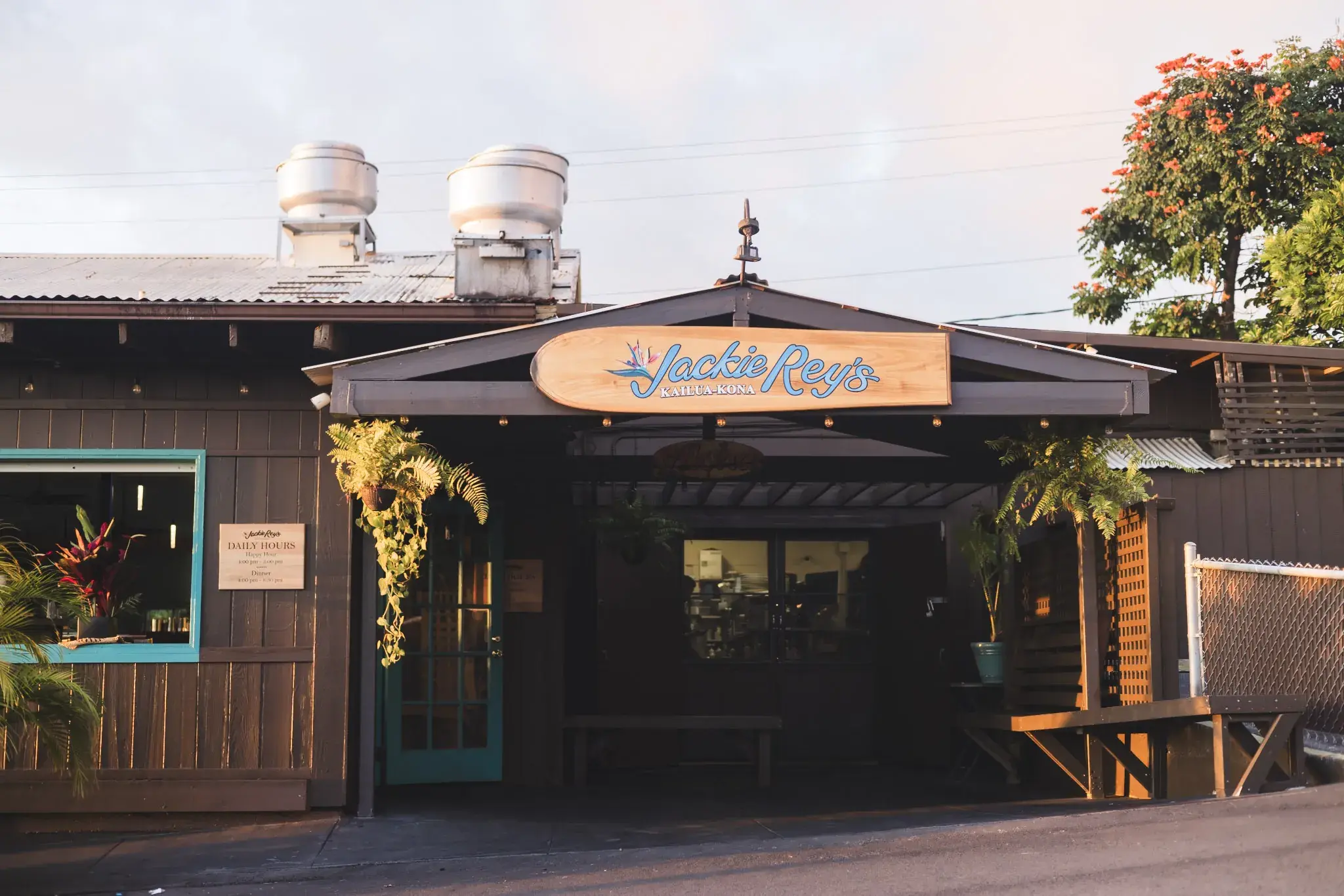 The open-air storefront and entrance of Jackie Rey's in Kailua-Kona at golden hour.