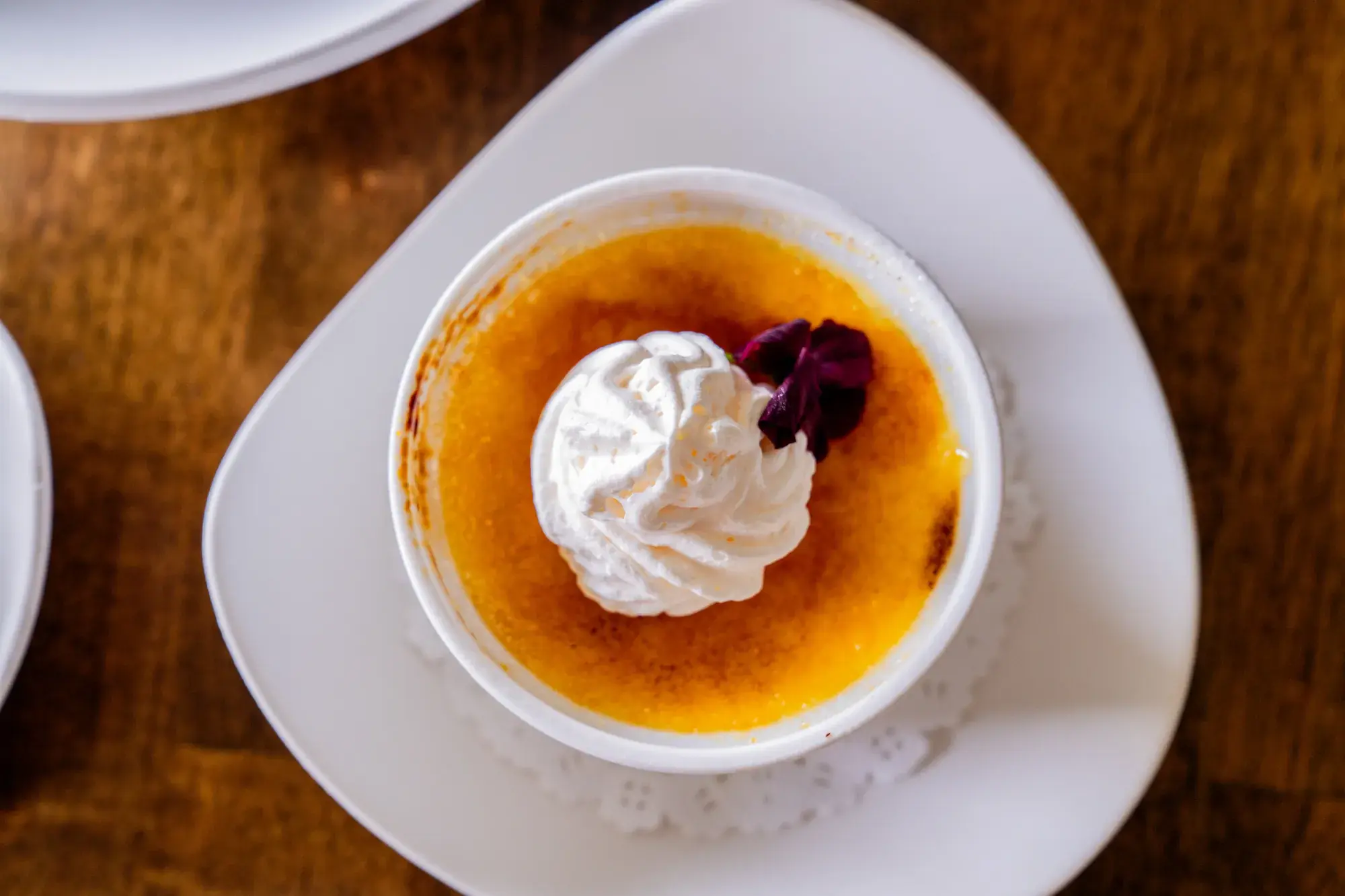 Crème Brûlée at Jackie Rey's Ohana Grill, Vanilla bean custard, whipped cream.