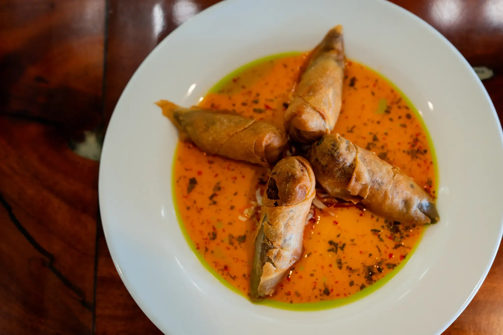 Kalua Pork Spring Rolls at Jackie Rey's Ohana Grill, Sweet herb chili sauce.