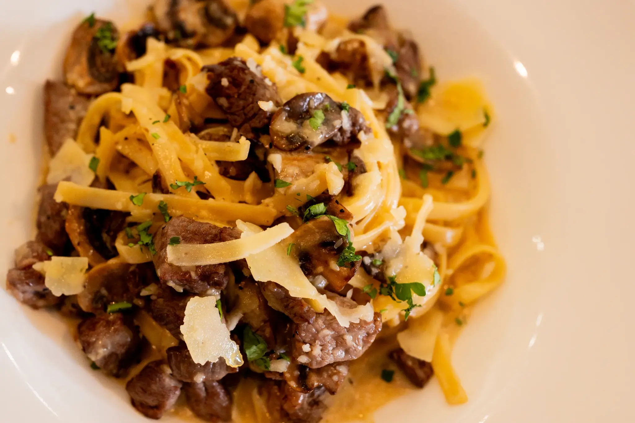 Steak & Mushroom at Jackie Rey's Ohana Grill, Filet bites, cream sauce, truffle oil, fettuccine, parmesan.